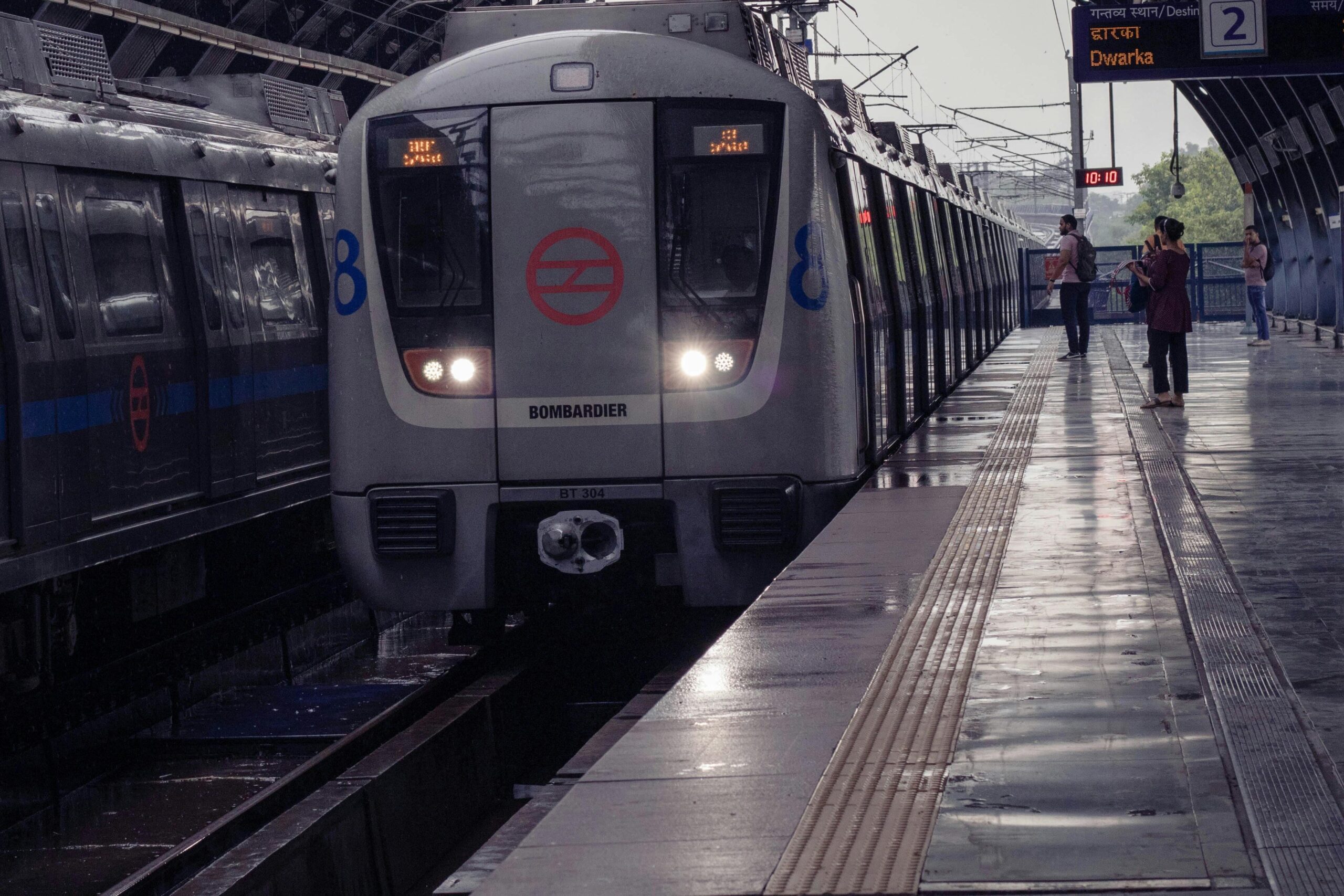 Inside the Delhi Airport Metro Express station at Terminal 3. Showing the fast, safe orange line train that connects the airport to New Delhi Railway Station in 20 minutes.